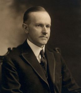 640px-Calvin_Coolidge,_bw_head_and_shoulders_photo_portrait_seated,_1919